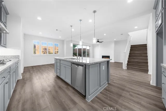 a view of an entryway with wooden floor and stairs