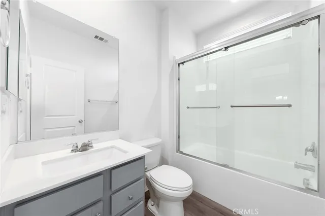 a bathroom with a sink a mirror and a shower