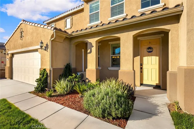 a view of empty room with wooden floor and window