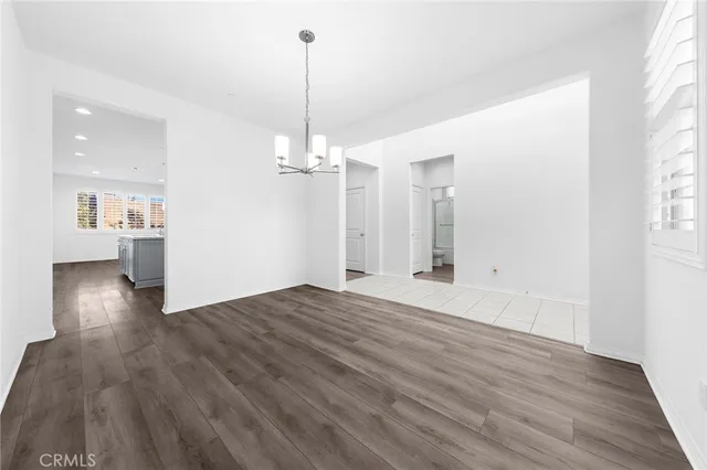 a kitchen with kitchen island a sink stainless steel appliances and cabinets