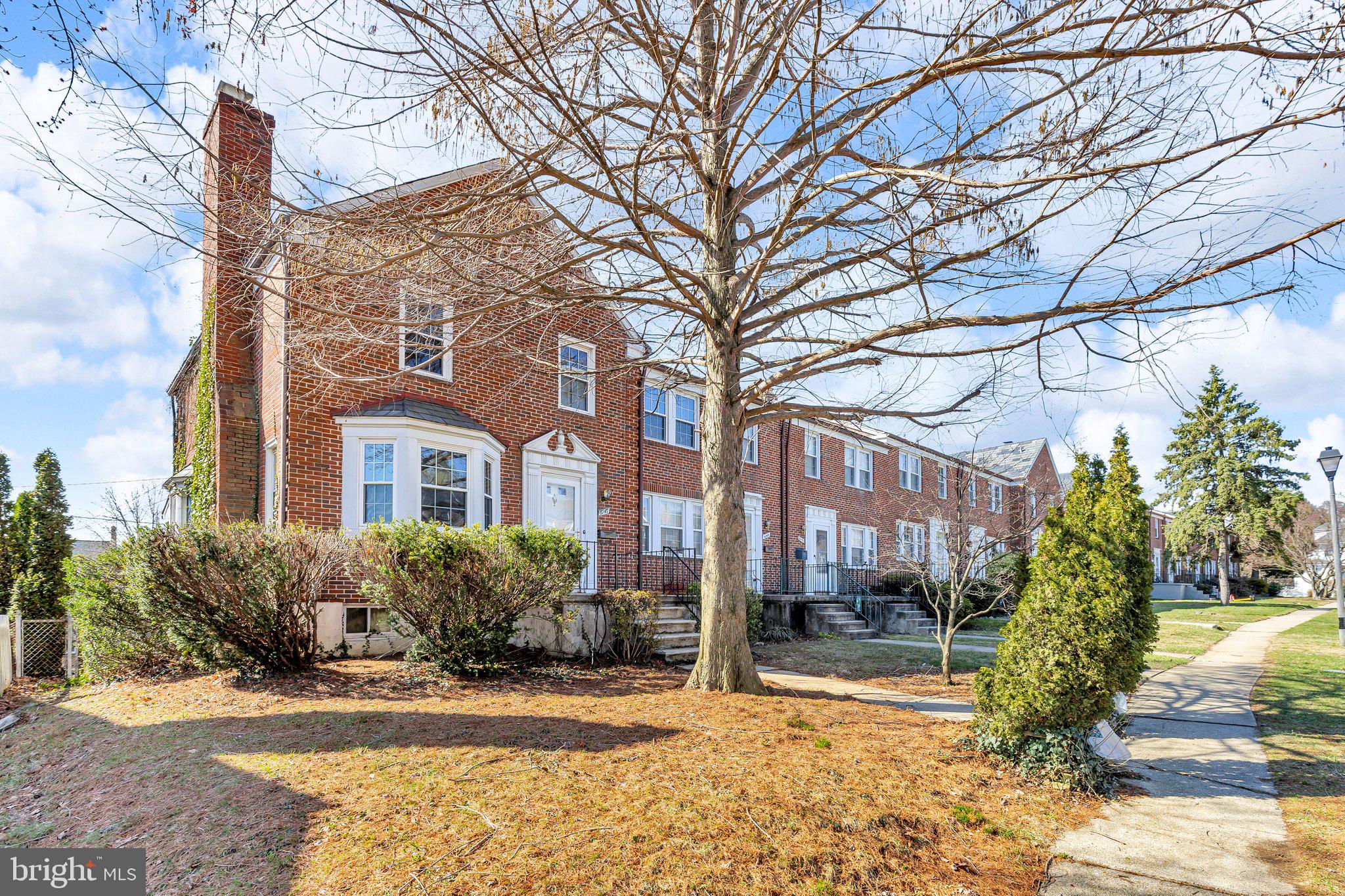 6147 Regent Park Road Catonsville, MD 21228 - Photo 1 of 22 a front view of a building with a garden and plants