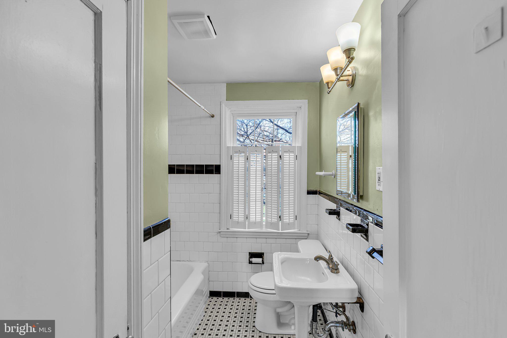 6147 Regent Park Road Catonsville, MD 21228 - Photo 11 of 22 a bathroom with a sink and a mirror