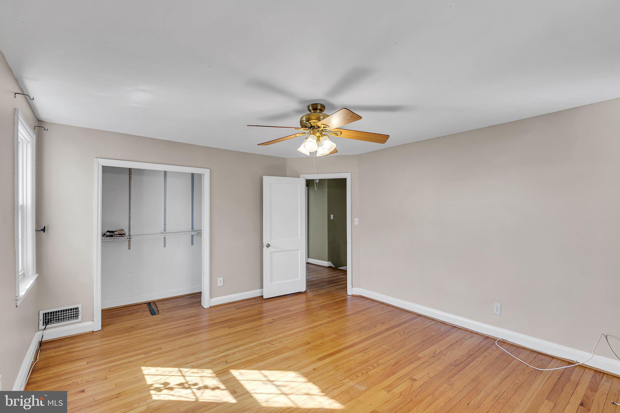 6147 Regent Park Road Catonsville, MD 21228 - Photo 12 of 22 a view of an empty room and wooden floor