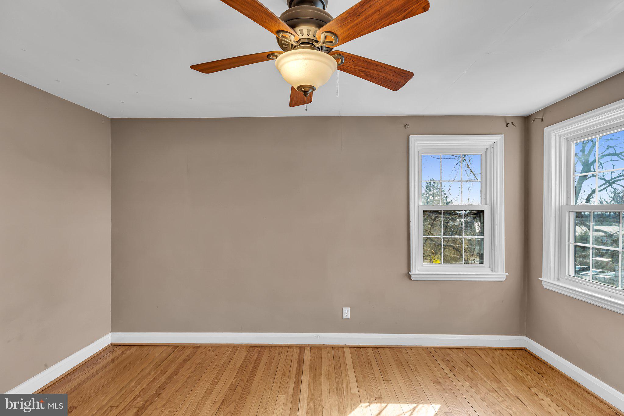 6147 Regent Park Road Catonsville, MD 21228 - Photo 17 of 22 a view of room with window and wooden floor