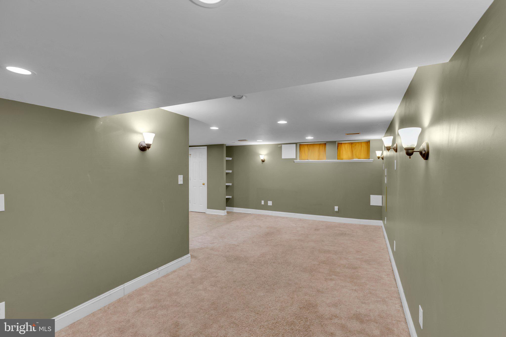 6147 Regent Park Road Catonsville, MD 21228 - Photo 18 of 22 an empty room with a space and mirror