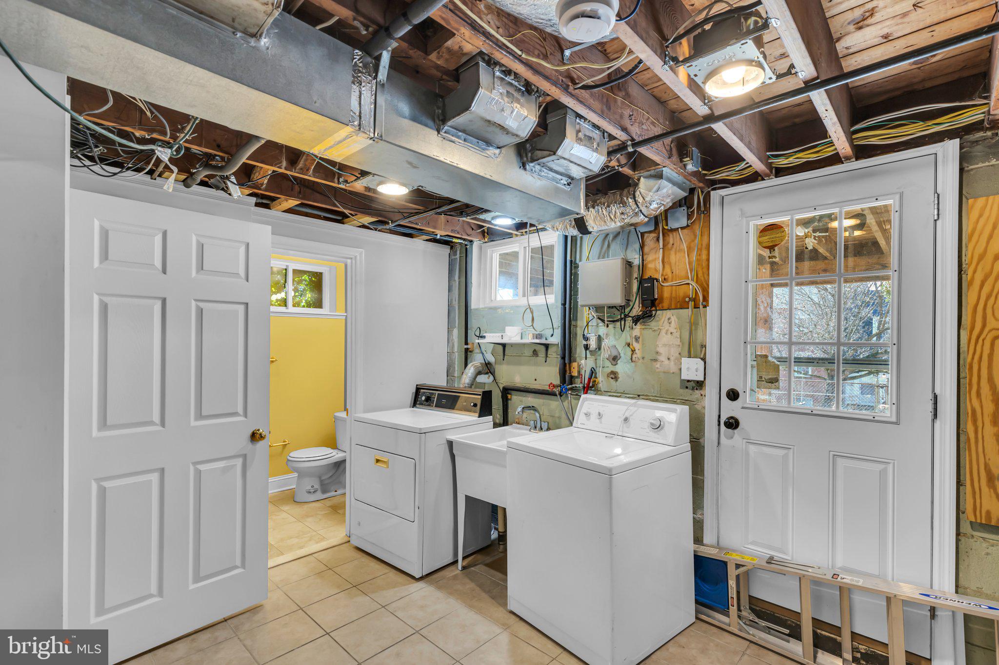 6147 Regent Park Road Catonsville, MD 21228 - Photo 19 of 22 a utility room with dryer and washer