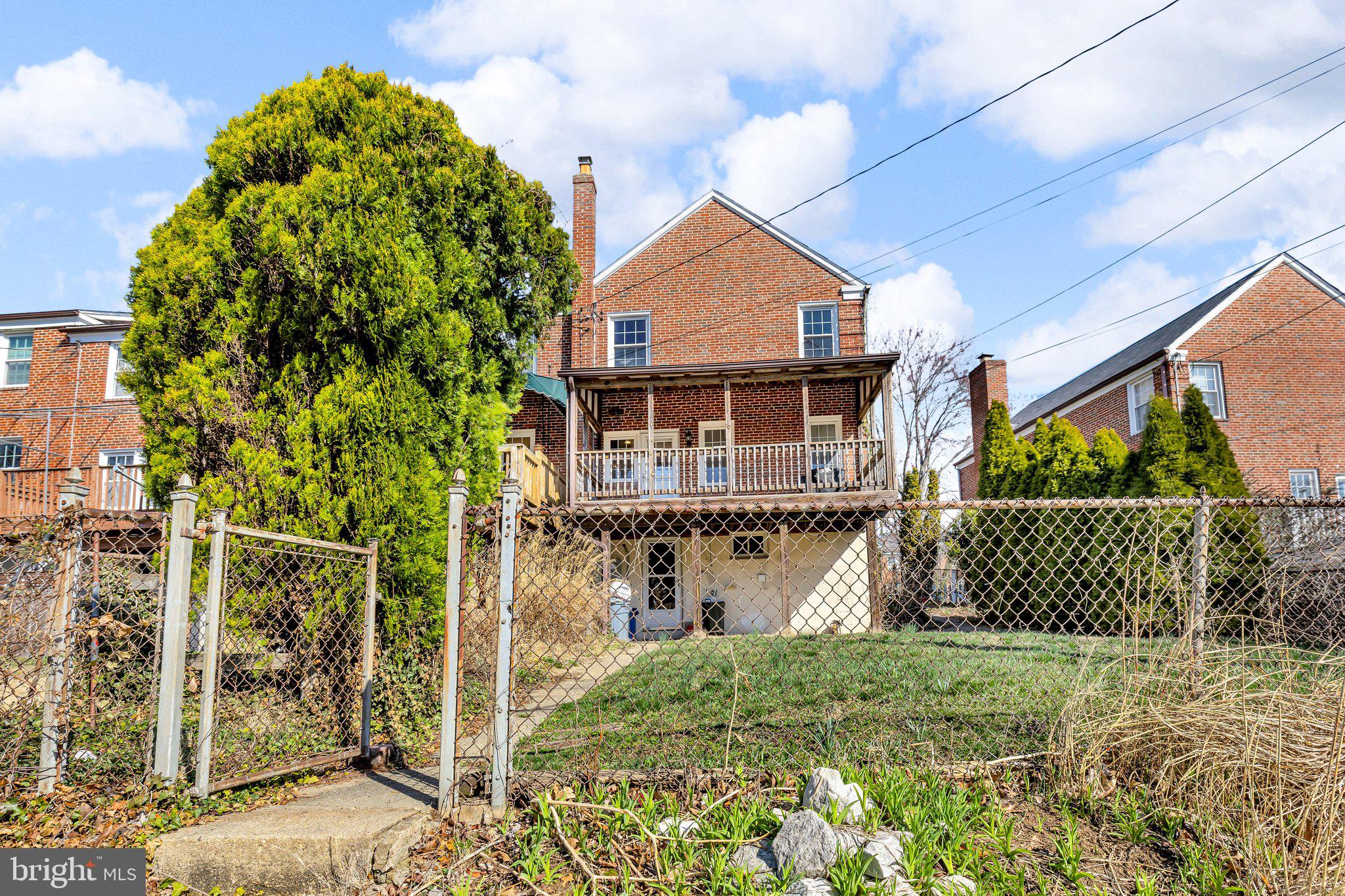 6147 Regent Park Road Catonsville, MD 21228 - Photo 21 of 22 a front view of a house with a garden