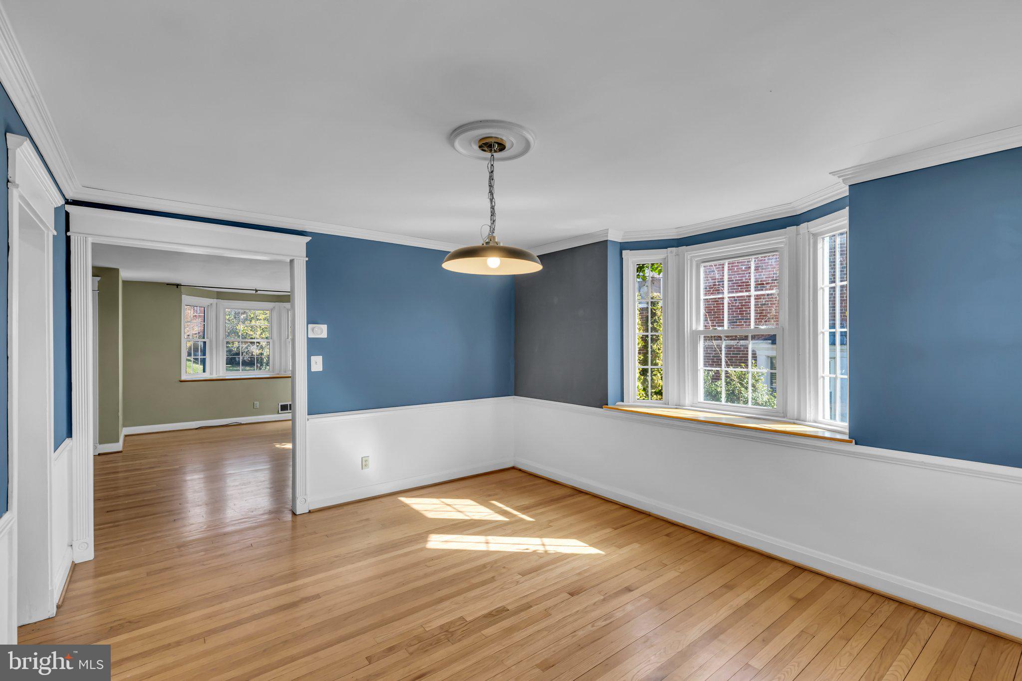 6147 Regent Park Road Catonsville, MD 21228 - Photo 5 of 22 a view of empty room with wooden floor and fan