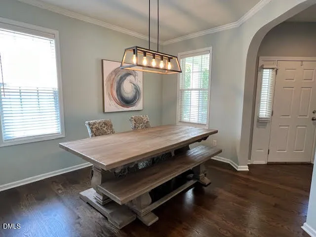 a view of a room with wooden floor windows and wooden floor