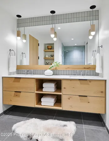 a bathroom with a sink a vanity and a mirror