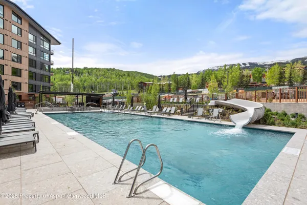 a view of a swimming pool with a patio