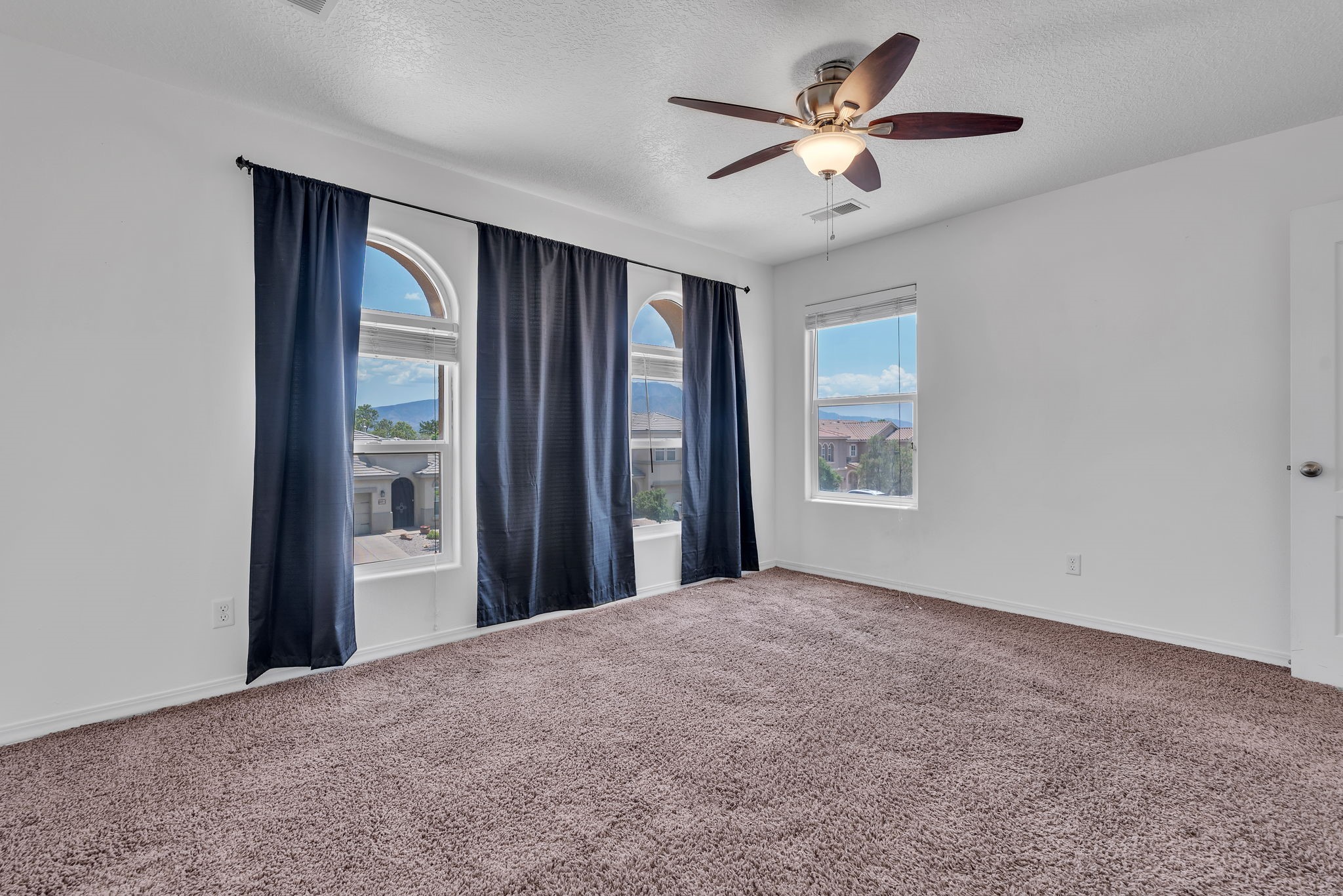 6914 Wrangell Loop Northeast Rio Rancho, NM 87144 - Photo 36 of 61 Bedroom with Street Views
