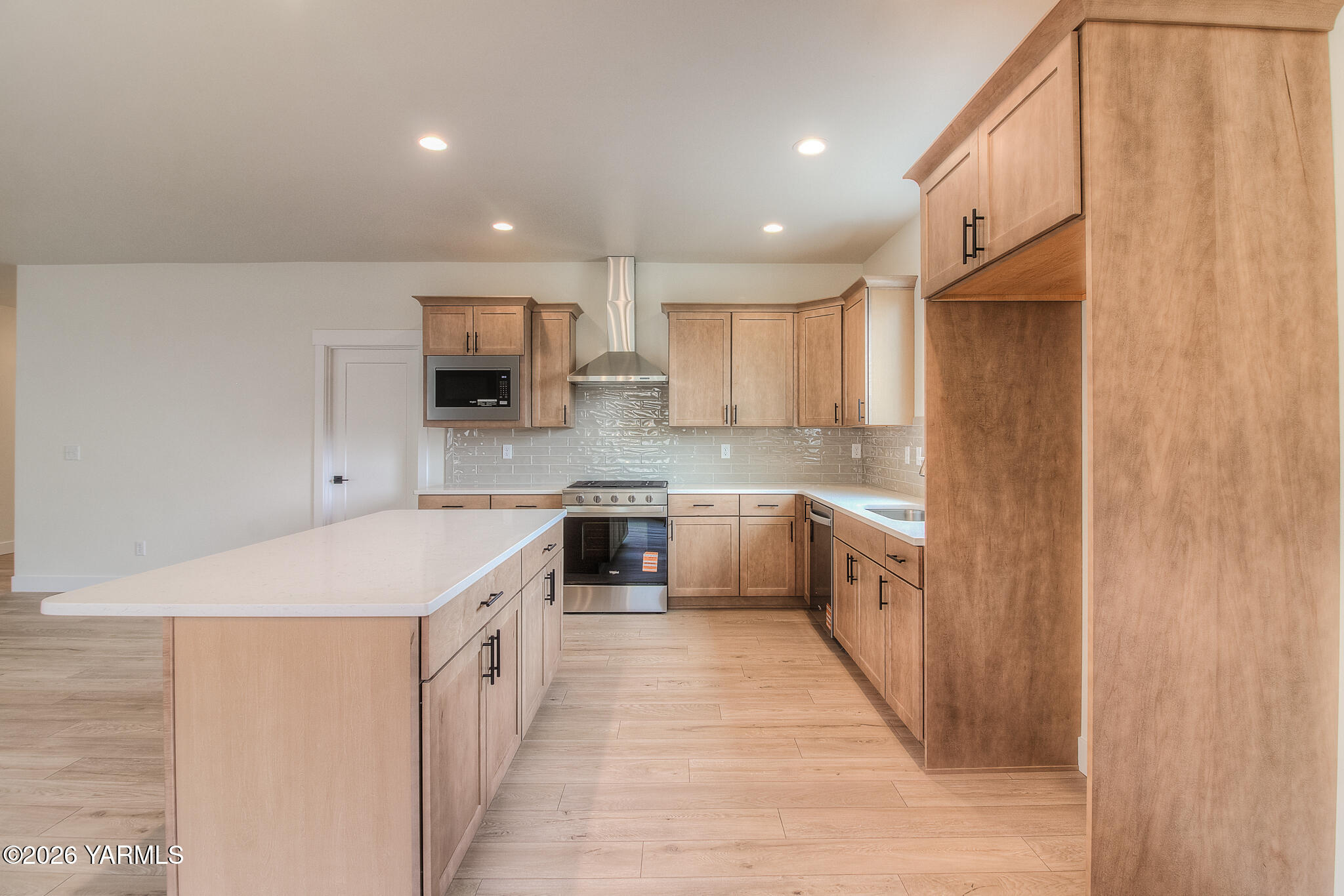 404 South 90th Avenue Yakima, WA 98908 - Photo 13 of 20 a kitchen with a sink a counter top space stainless steel appliances and cabinets