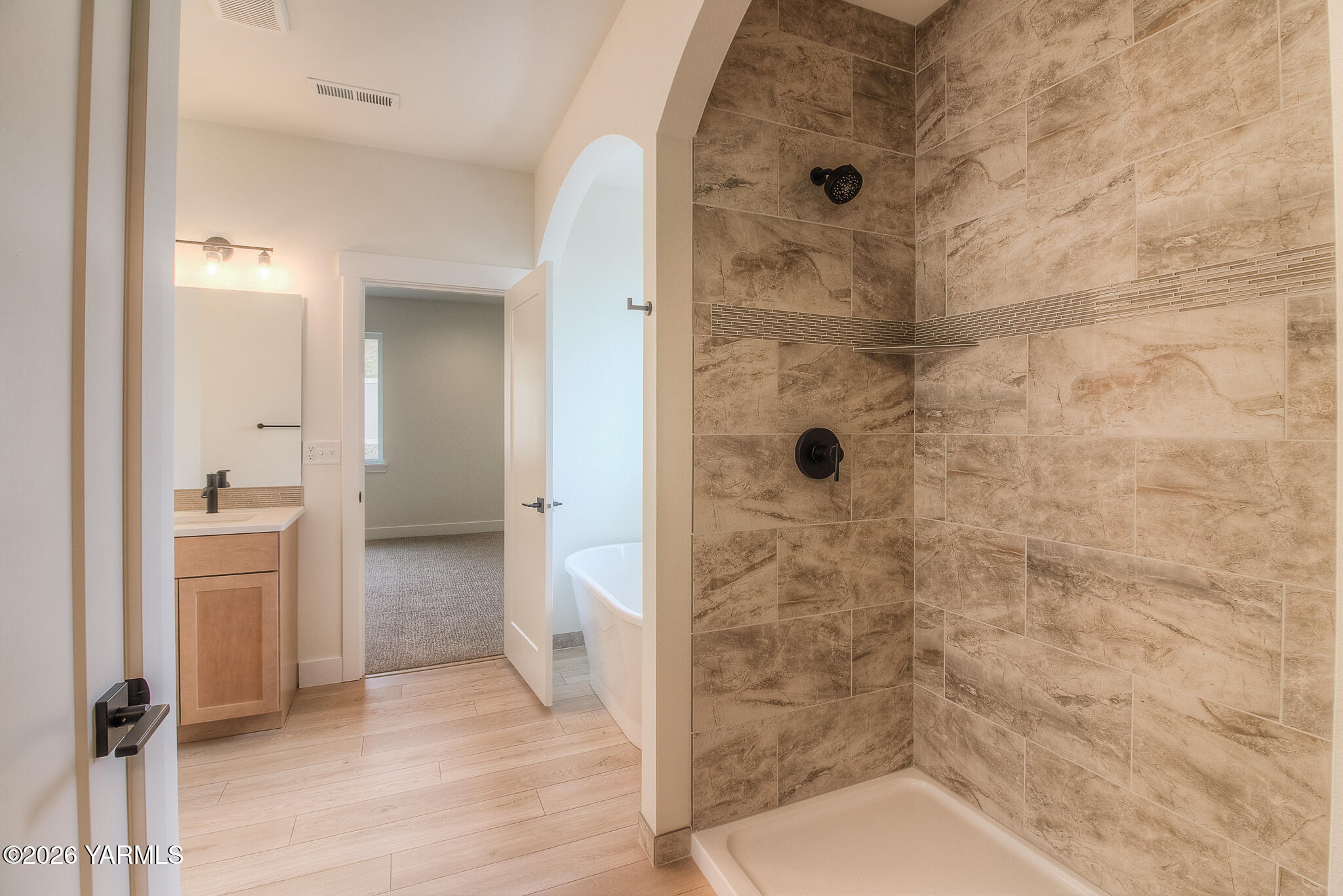 404 South 90th Avenue Yakima, WA 98908 - Photo 17 of 20 a bathroom with a granite countertop shower