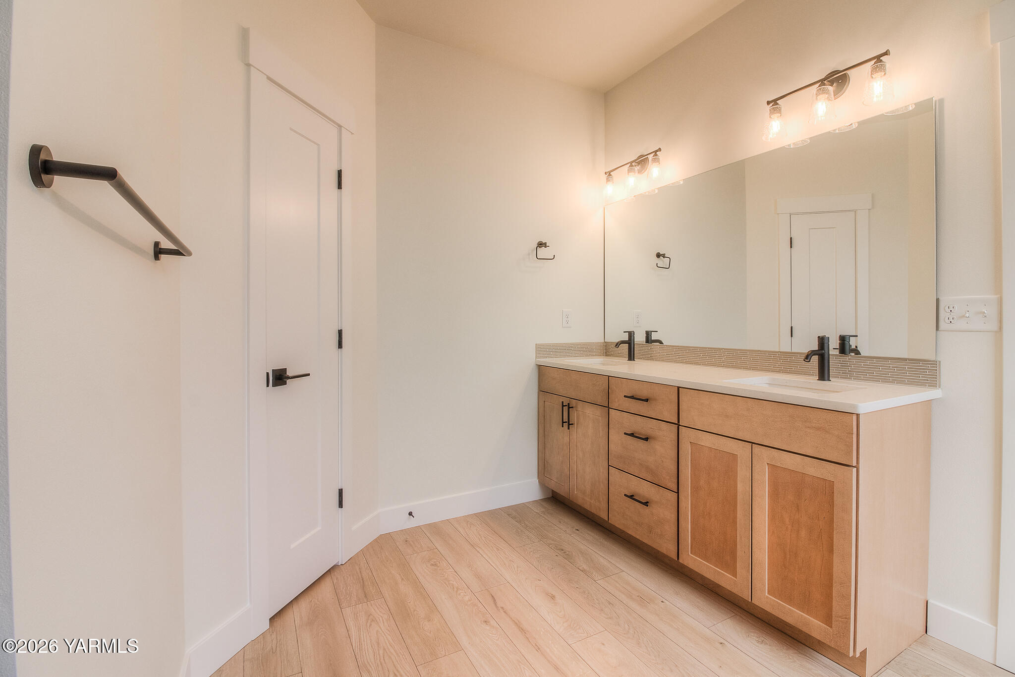 404 South 90th Avenue Yakima, WA 98908 - Photo 18 of 20 a spacious bathroom with a double vanity sink a mirror and shower