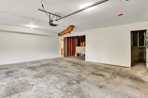 a view of a livingroom with wooden floor and cabinet