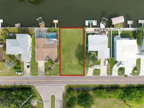 an aerial view of a house with a swimming pool