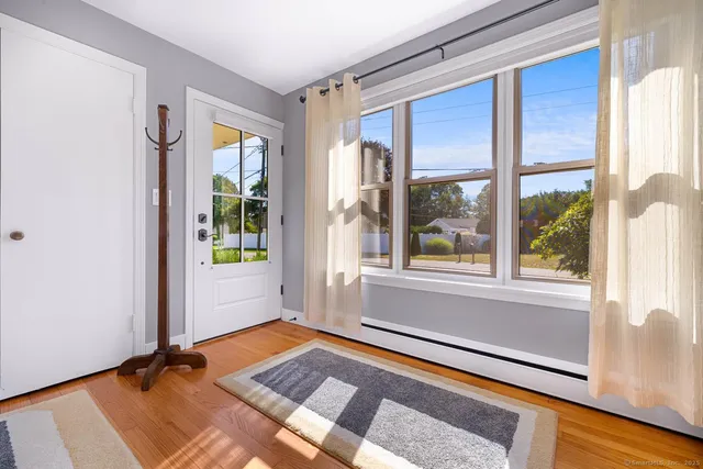 a rug sitting in front of a window