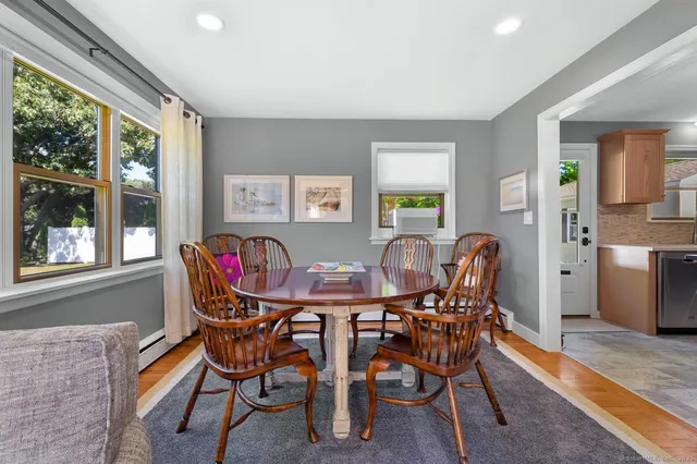 a view of a dining room with furniture and window