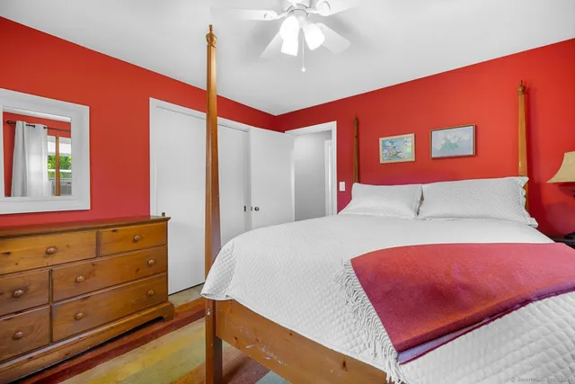 a bedroom with a bed and a dresser