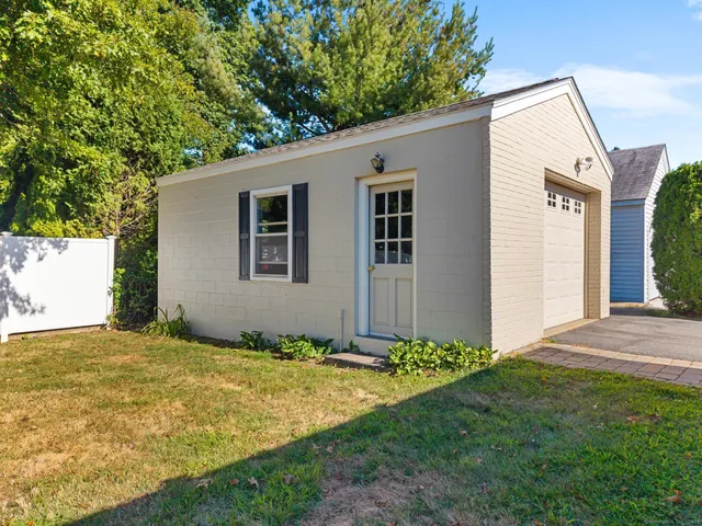 a view of house with swimming pool outdoor seating