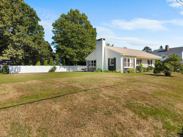 a view of a house with a yard