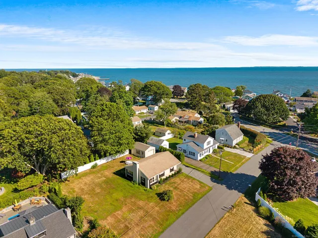 an aerial view of a house with a swimming pool