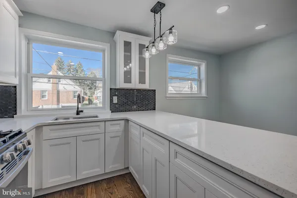 a kitchen with sink cabinets and window