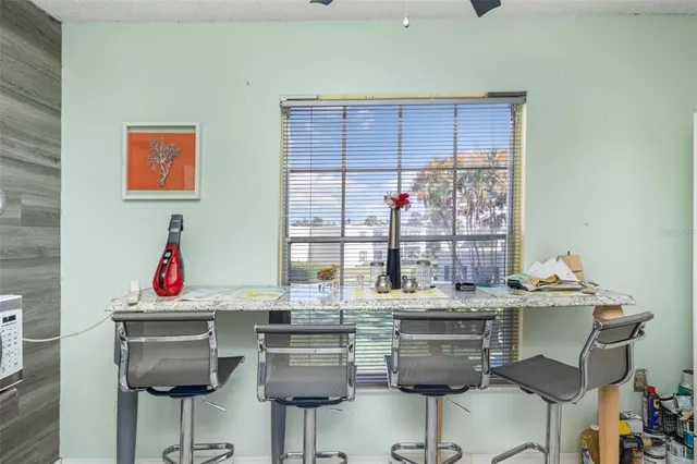 a dining room with table chairs and a dining table