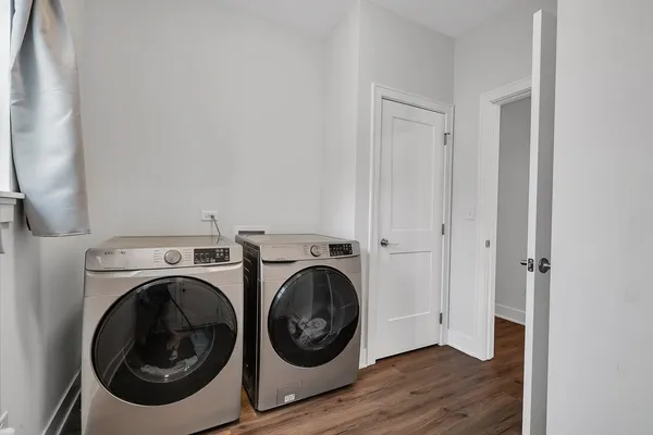 a view of a hallway with washer and dryer