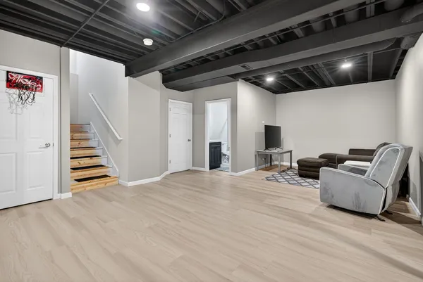 a view of livingroom with furniture and stairs