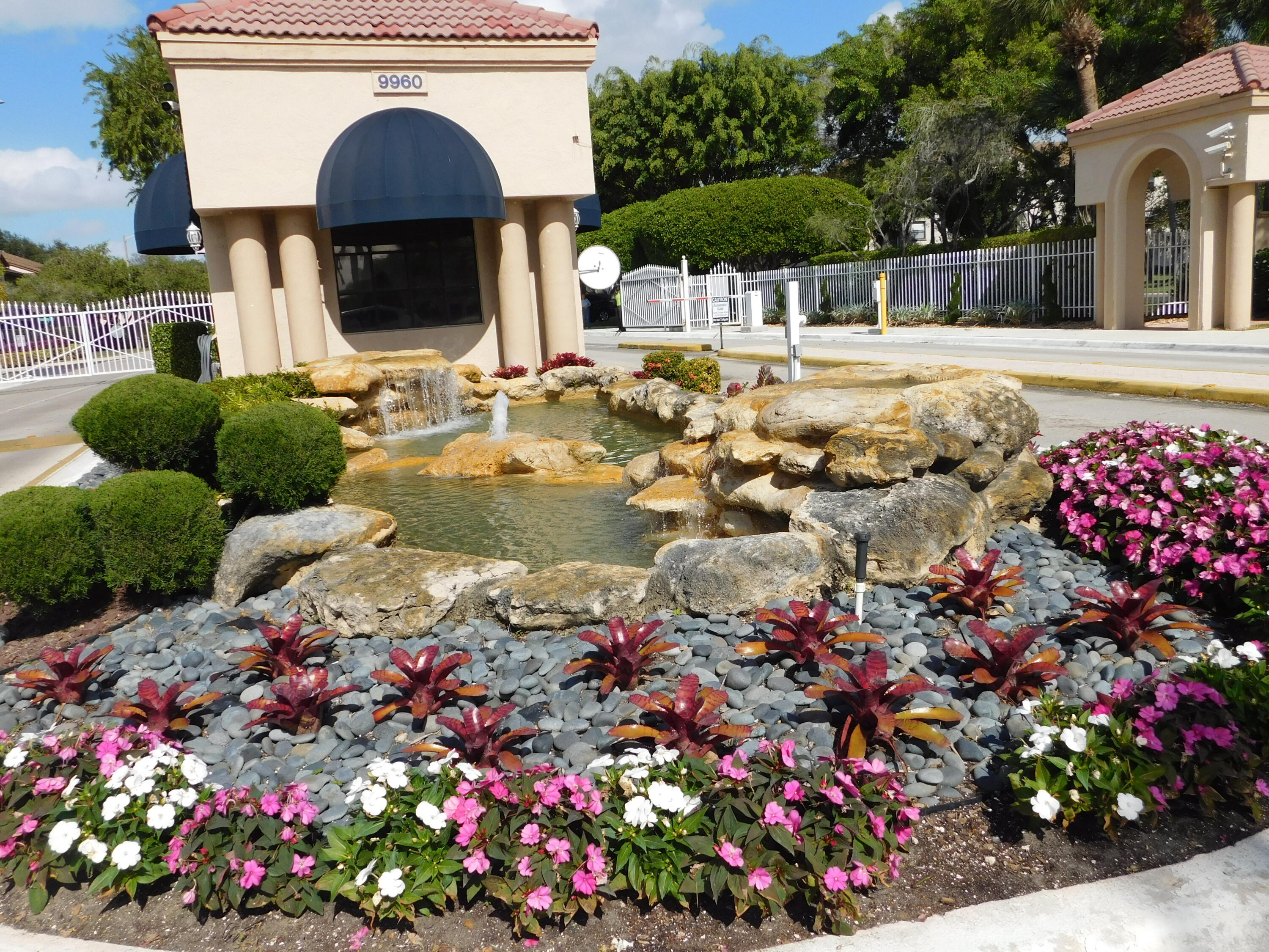 5235 Europa Drive, Unit E Boynton Beach, FL 33437 - Photo 30 of 57 a front view of house with yard