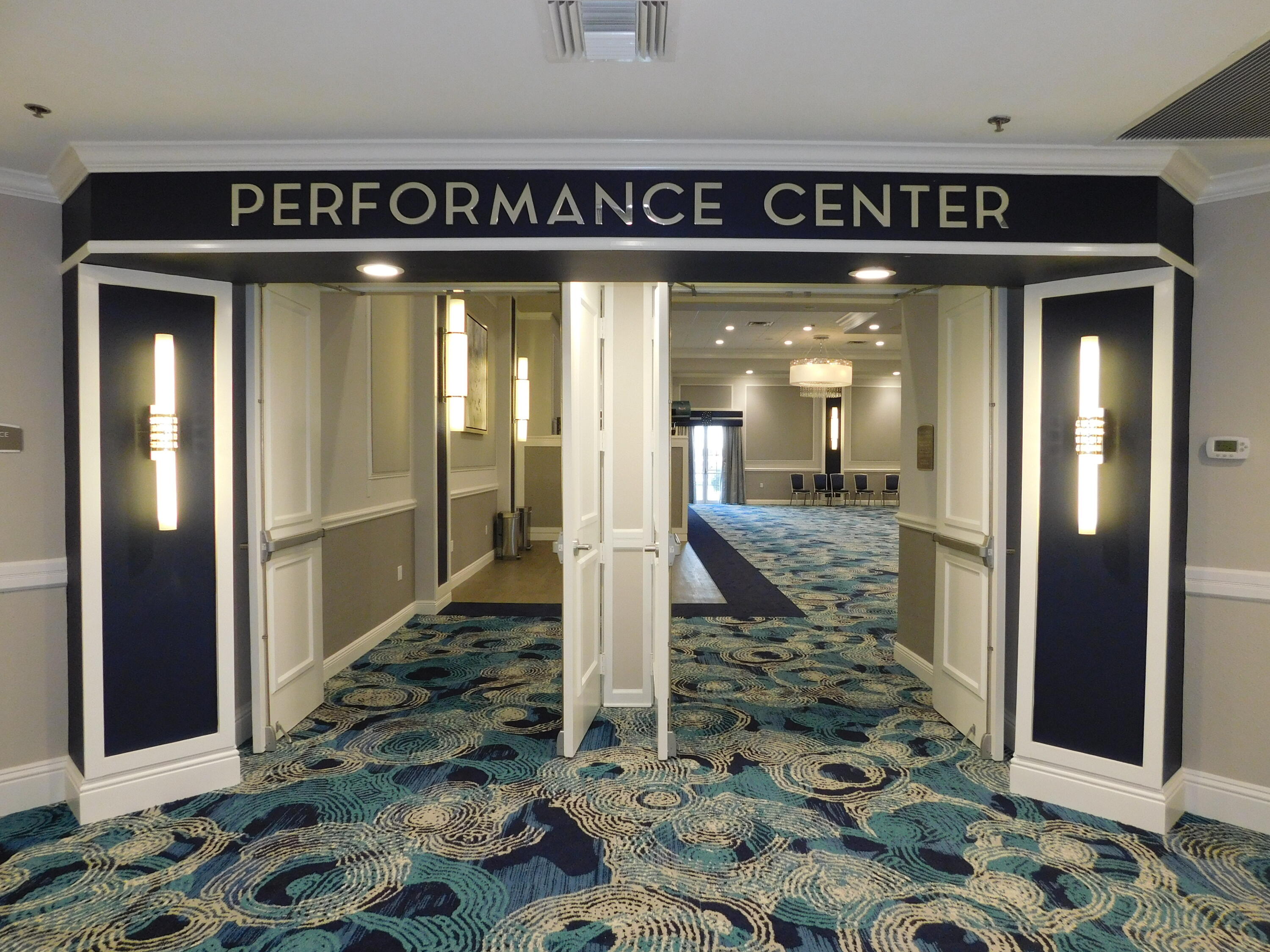 5235 Europa Drive, Unit E Boynton Beach, FL 33437 - Photo 36 of 57 a view of a hallway with wooden floor