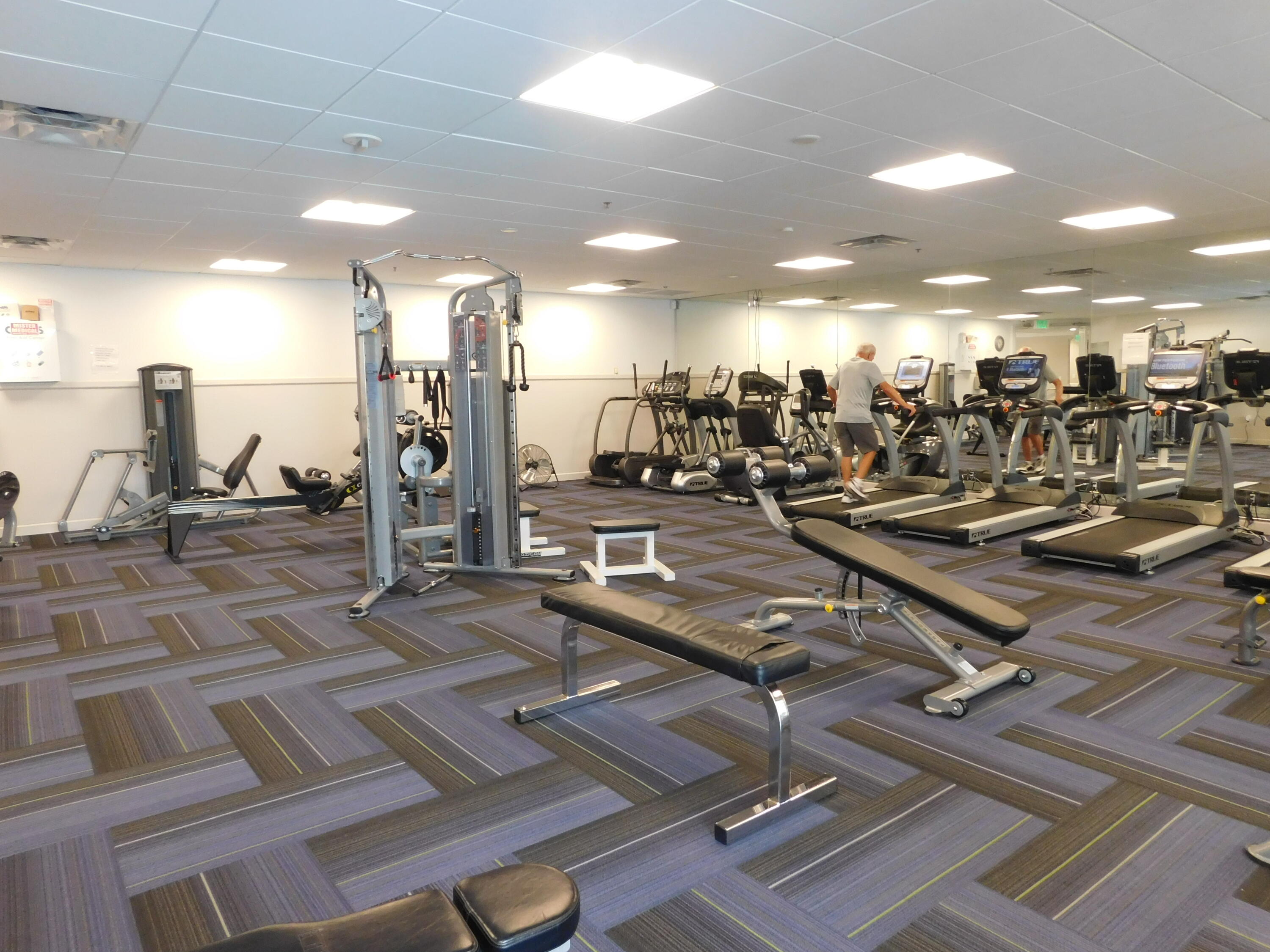 5235 Europa Drive, Unit E Boynton Beach, FL 33437 - Photo 48 of 57 a view of a room with gym equipment