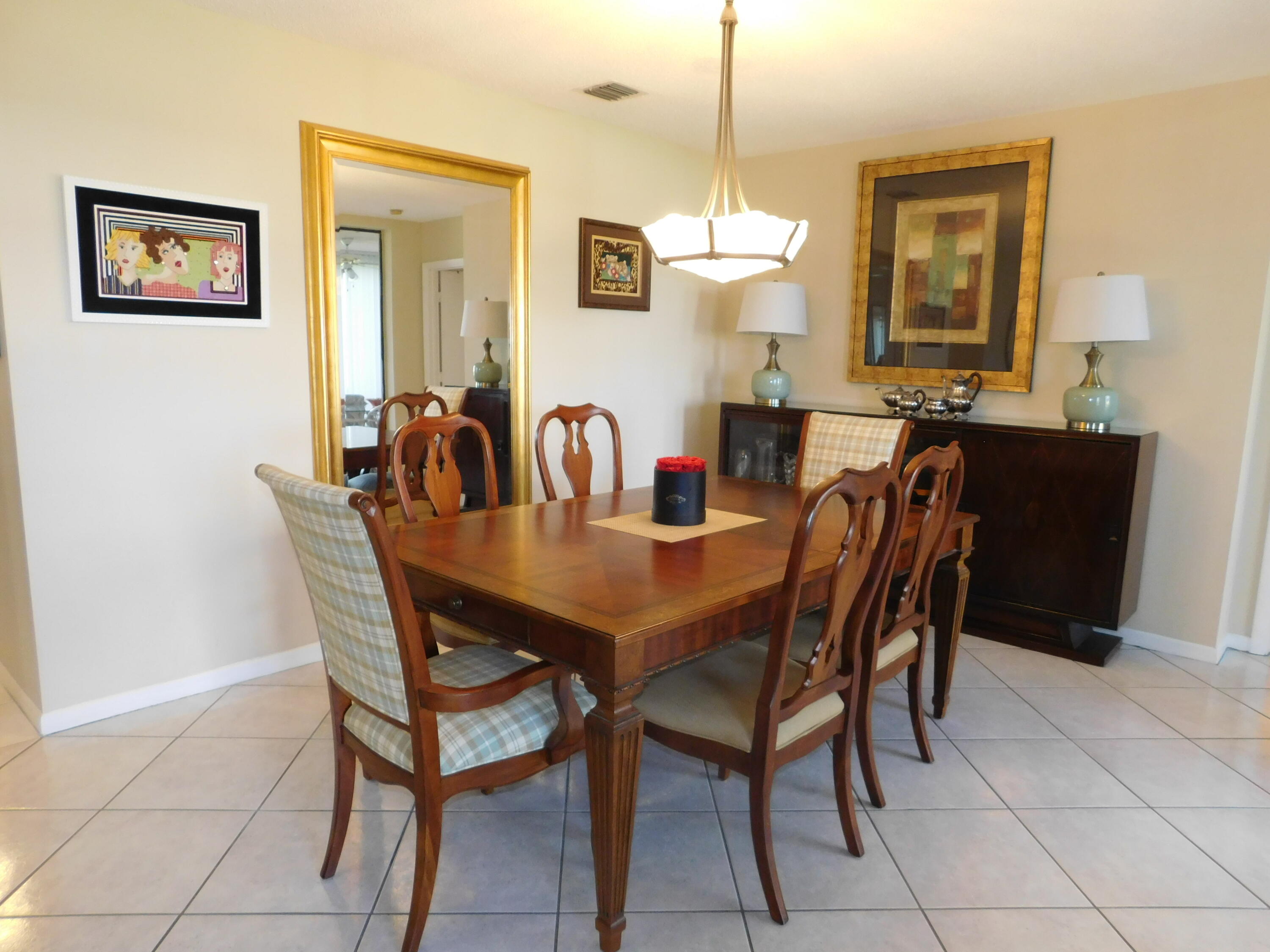 5235 Europa Drive, Unit E Boynton Beach, FL 33437 - Photo 9 of 57 a view of a dining room with furniture