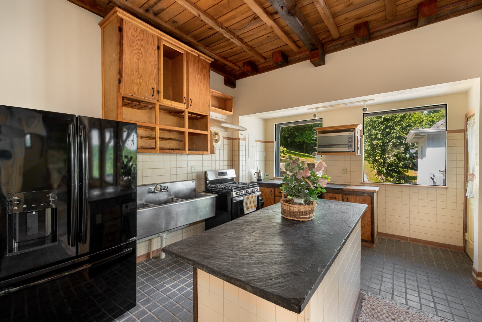 278 Captain Point Silver Point, TN 38582 - Photo 14 of 41 a kitchen with a refrigerator and potted plant