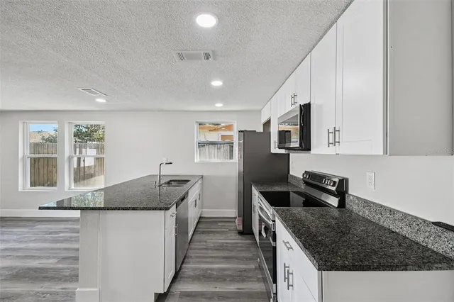 a bedroom with a large bed and furniture