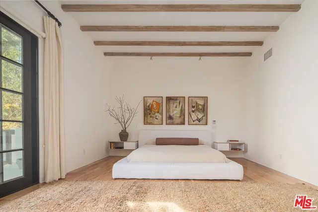 a bedroom with furniture and a fireplace