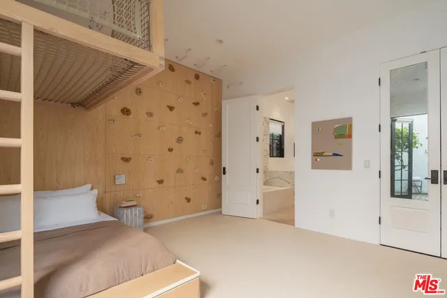 a view of a bathroom with a glass door shower
