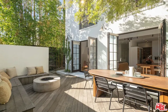 a outdoor dining space with furniture and outdoor view