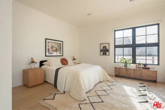 a view of a room with a potted plant and wooden floor