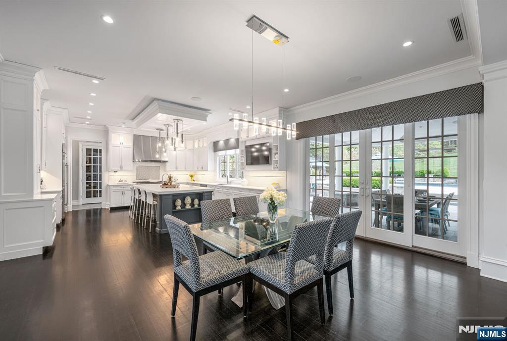 236 East Saddle River Road Saddle River, NJ 07458 - Photo 14 of 50 a view of a dining room with furniture and wooden floor