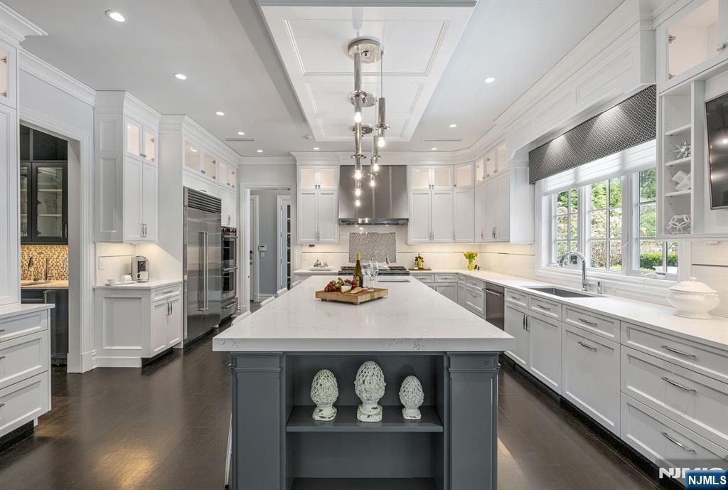 236 East Saddle River Road Saddle River, NJ 07458 - Photo 15 of 50 a kitchen with sink and wooden floor