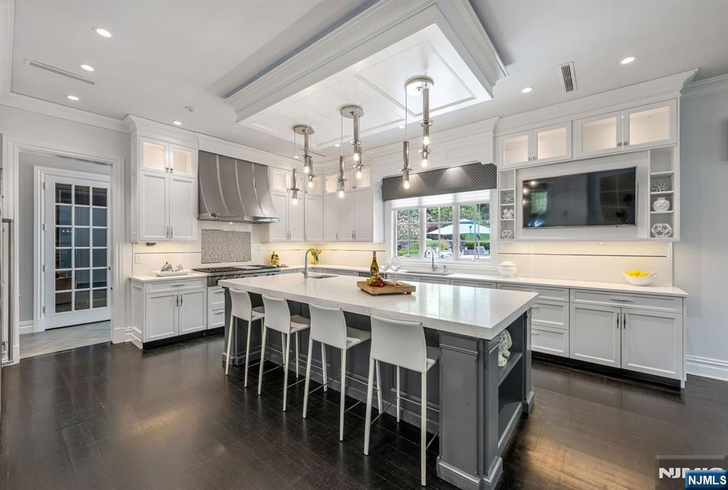 236 East Saddle River Road Saddle River, NJ 07458 - Photo 16 of 50 a kitchen with lots of counter top space and refrigerator