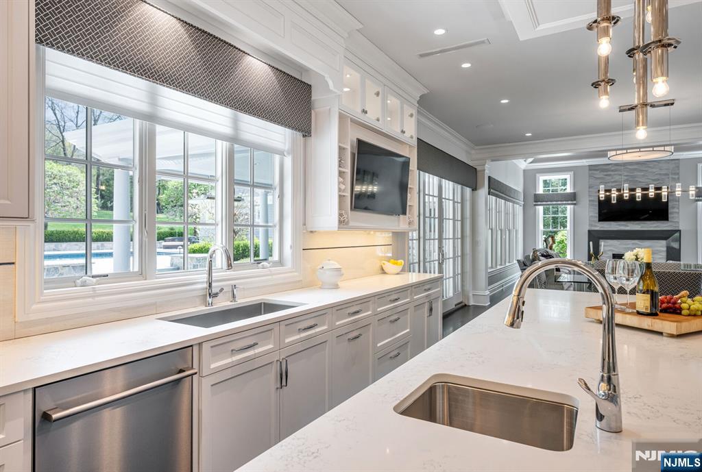 236 East Saddle River Road Saddle River, NJ 07458 - Photo 17 of 50 a kitchen that has a sink and a stove in it
