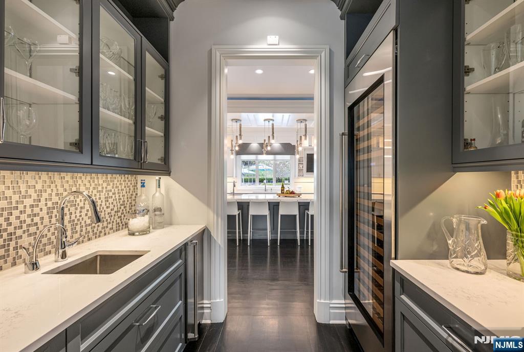 236 East Saddle River Road Saddle River, NJ 07458 - Photo 20 of 50 a kitchen with a sink and chairs