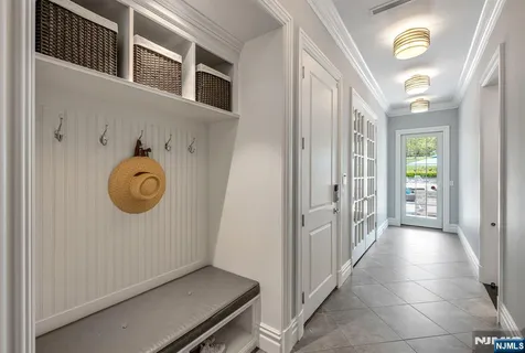 a view of a hallway to door with window