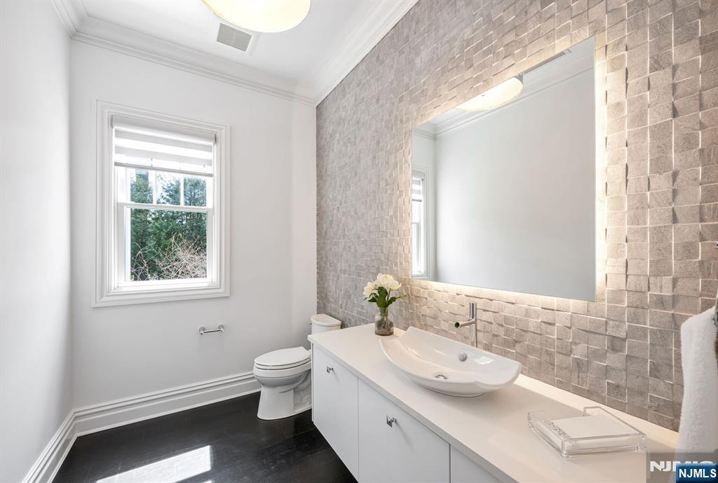 236 East Saddle River Road Saddle River, NJ 07458 - Photo 24 of 50 a bathroom with a granite countertop sink toilet and mirror