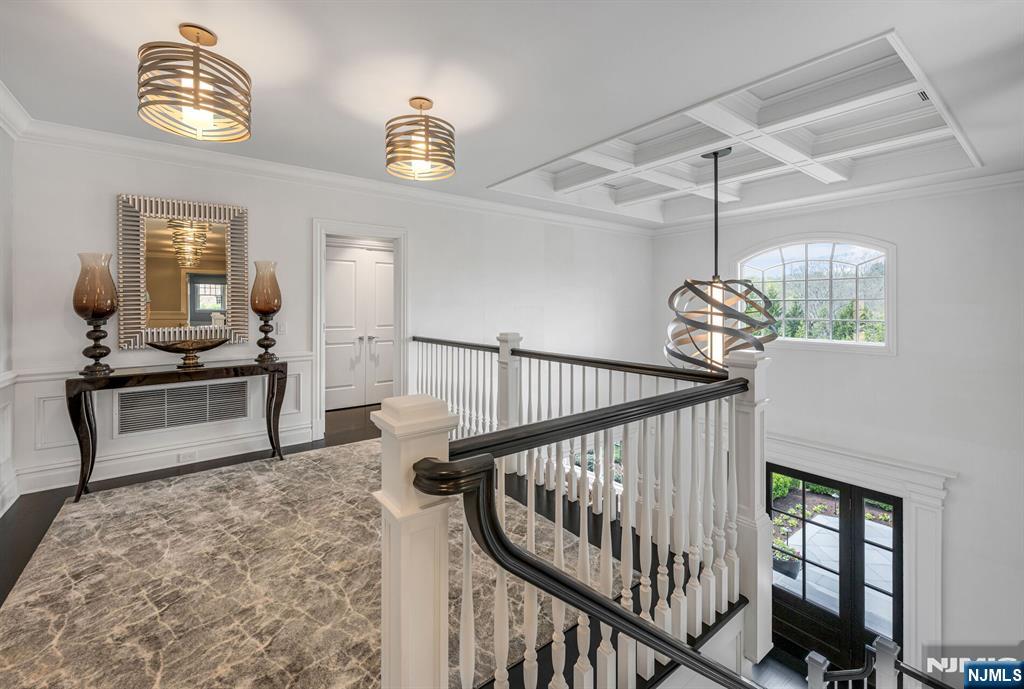 236 East Saddle River Road Saddle River, NJ 07458 - Photo 25 of 50 a view of a livingroom with wooden floor and stairs