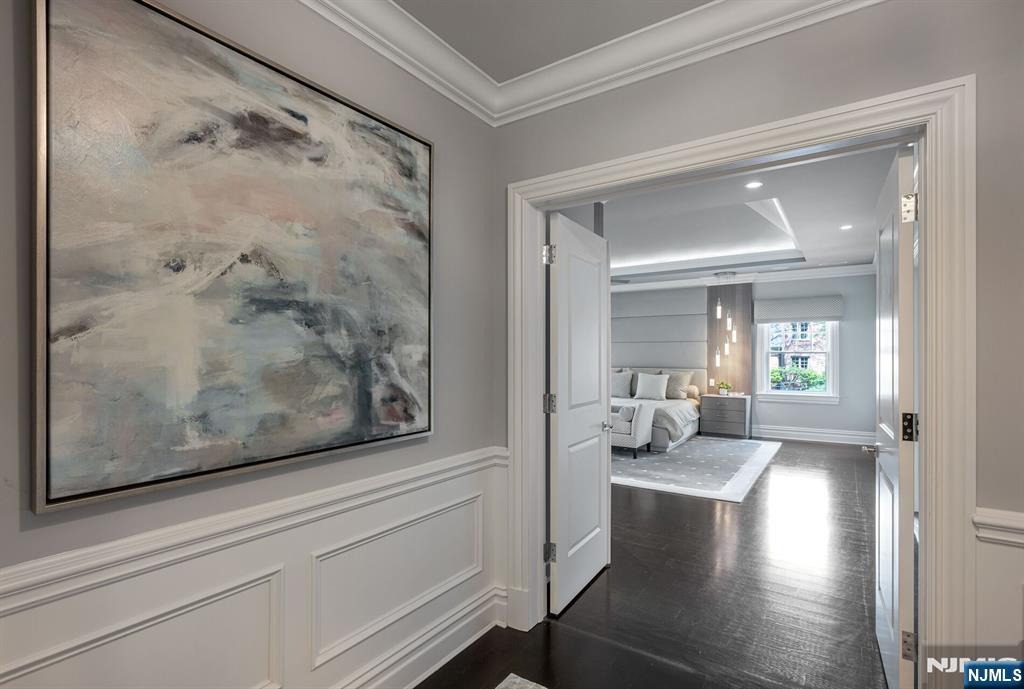 236 East Saddle River Road Saddle River, NJ 07458 - Photo 26 of 50 a view of a living room and bedroom with wooden floor